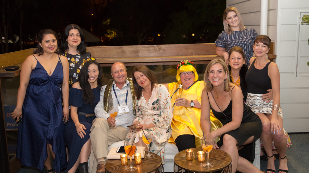 Tom Goldman with Goldman team members at "Touch of Gold" dinner